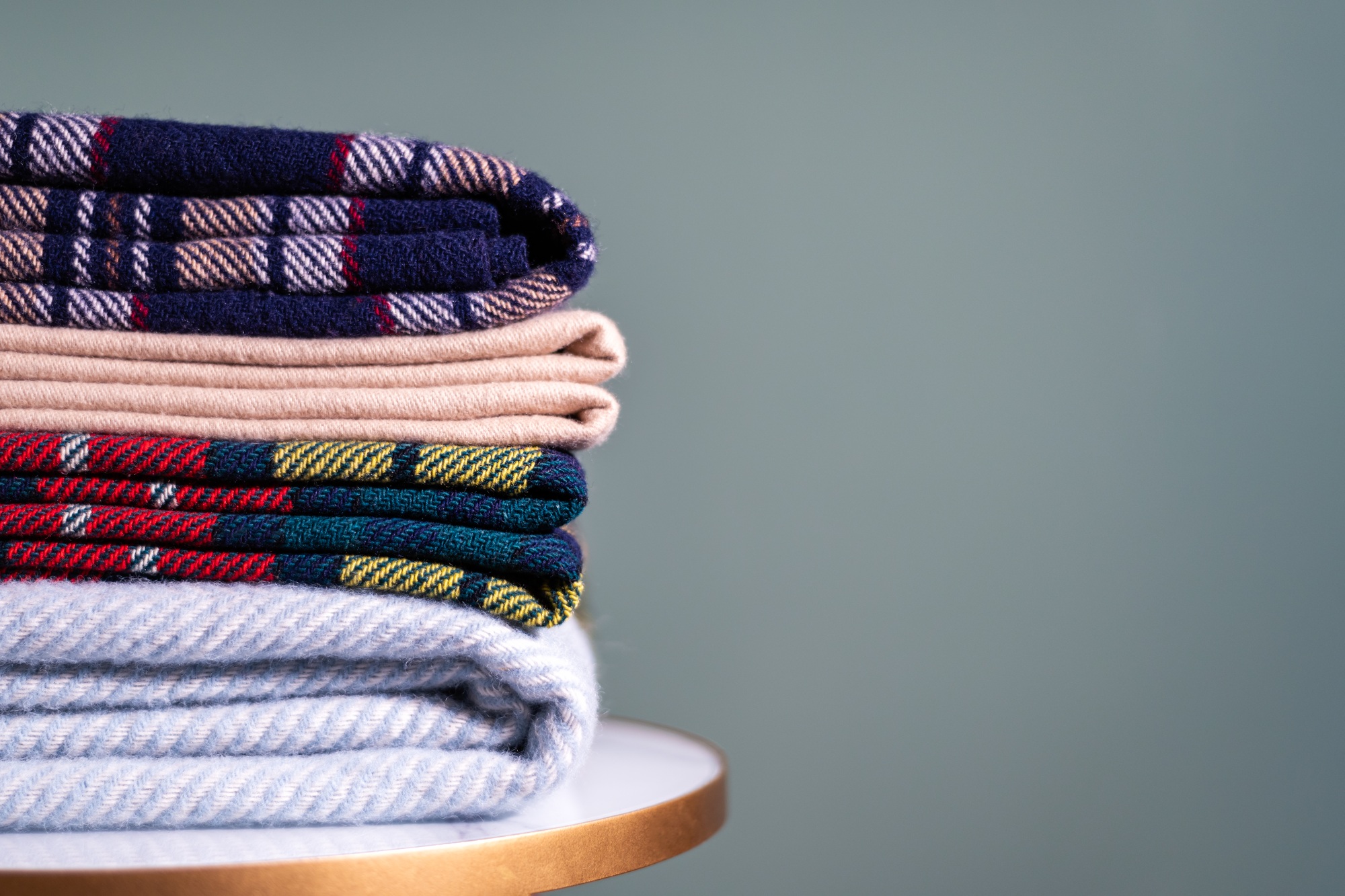 Stack of woolen checked blankets